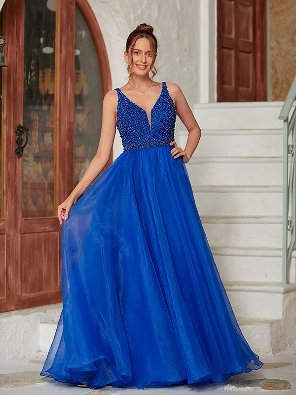 Elegant A-line Princess organza prom dress with V-neck and intricate beading.
