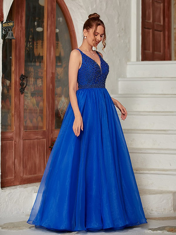 Close-up of the delicate beading on the V-neck prom dress.