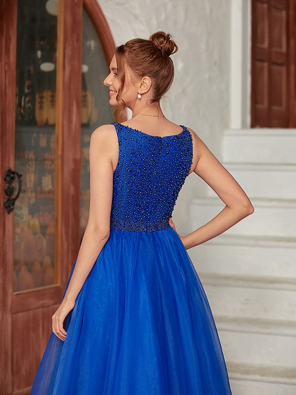 Full view of the sleeveless white organza evening dress.
