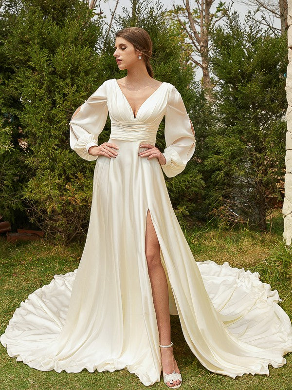 Bride wearing Weitese A-Line Princess wedding dress with V-neck and long sleeves.