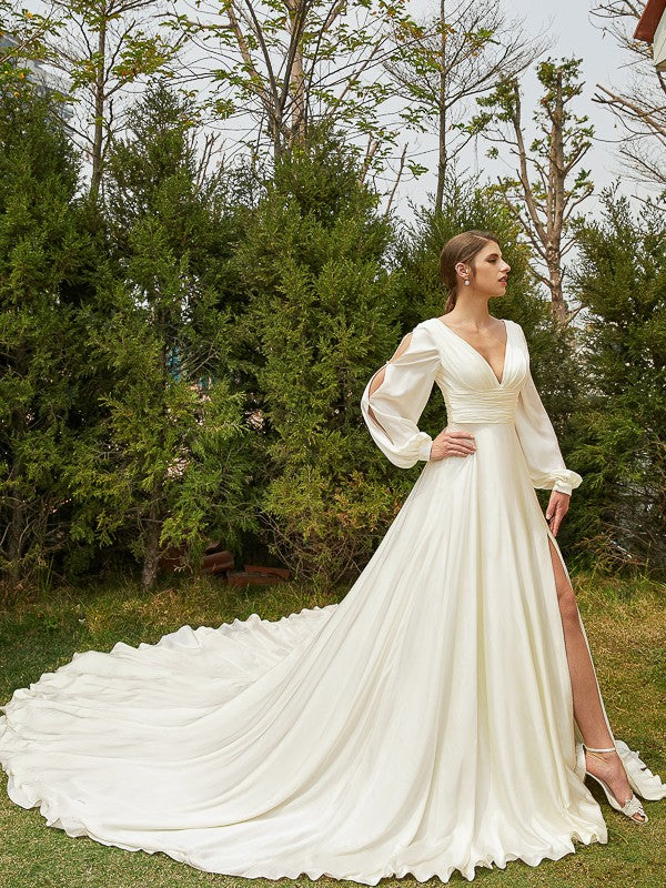 Close-up of ruched V-neck and long sleeves on Weitese wedding gown.