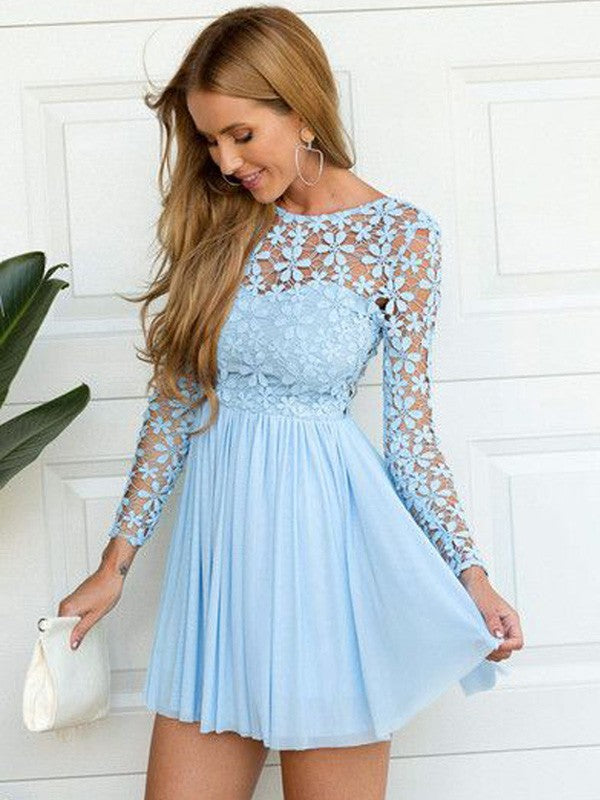 Woman wearing a white A-line lace and chiffon short party dress with long sleeves and a scoop neck.