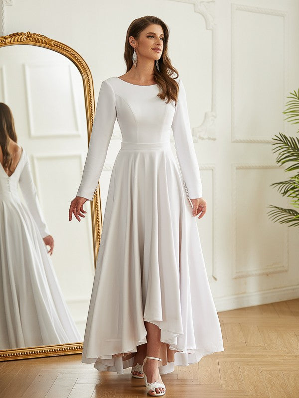 Full length view of bride wearing Weitese asymmetrical wedding dress.