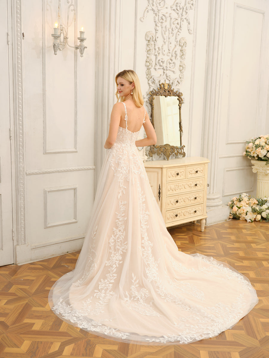 Side view of the A-line princess wedding dress, showcasing the flowing skirt and appliques.