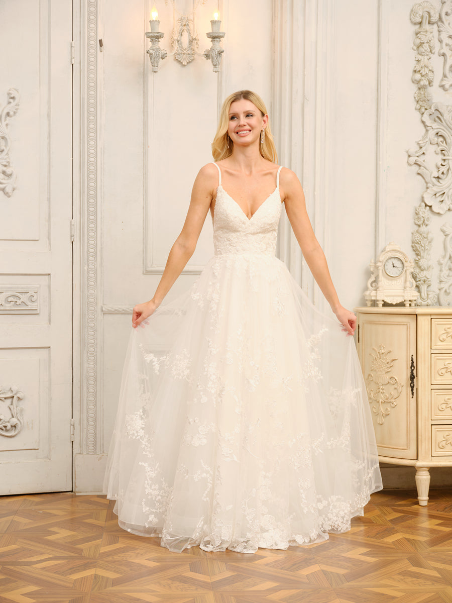 Back view of the elegant A-Line Princess wedding gown, showcasing the flowing skirt and delicate straps.