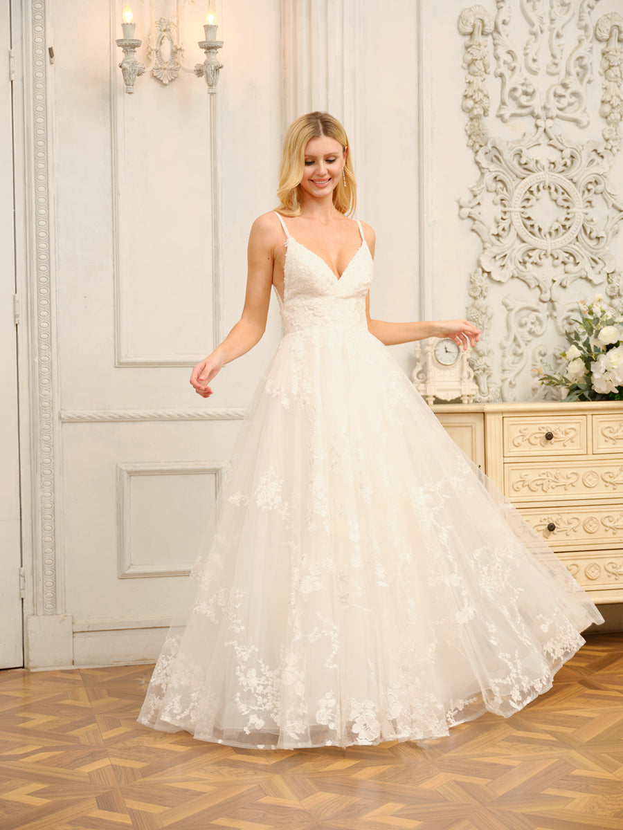 Side profile of the long A-Line Princess wedding dress, highlighting its silhouette and applique details.