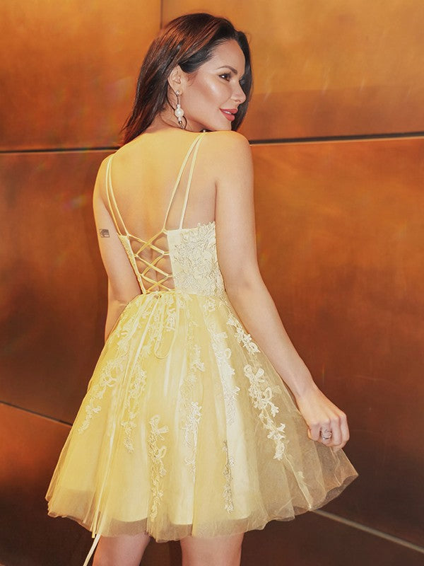 Back view of a short A-Line Princess homecoming dress with spaghetti straps.