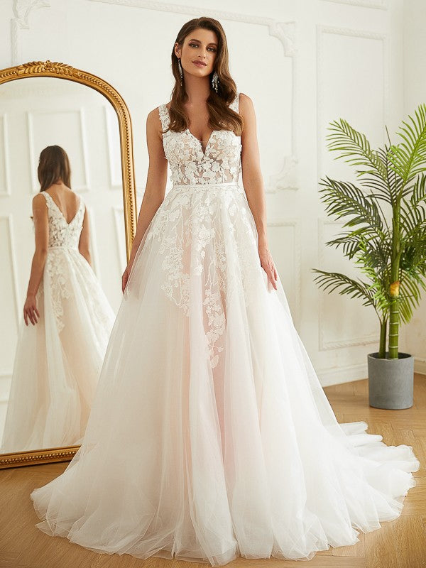 Elegant A-Line Princess wedding dress with tulle and applique details, featuring a V-neck and chapel train.