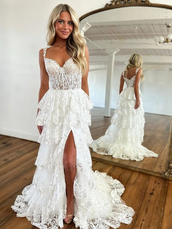 Close-up of the dress bodice, showcasing the intricate lace straps and tulle fabric.