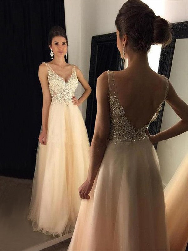 Elegant A-line Princess V-neck floor-length tulle gown with delicate applique details.