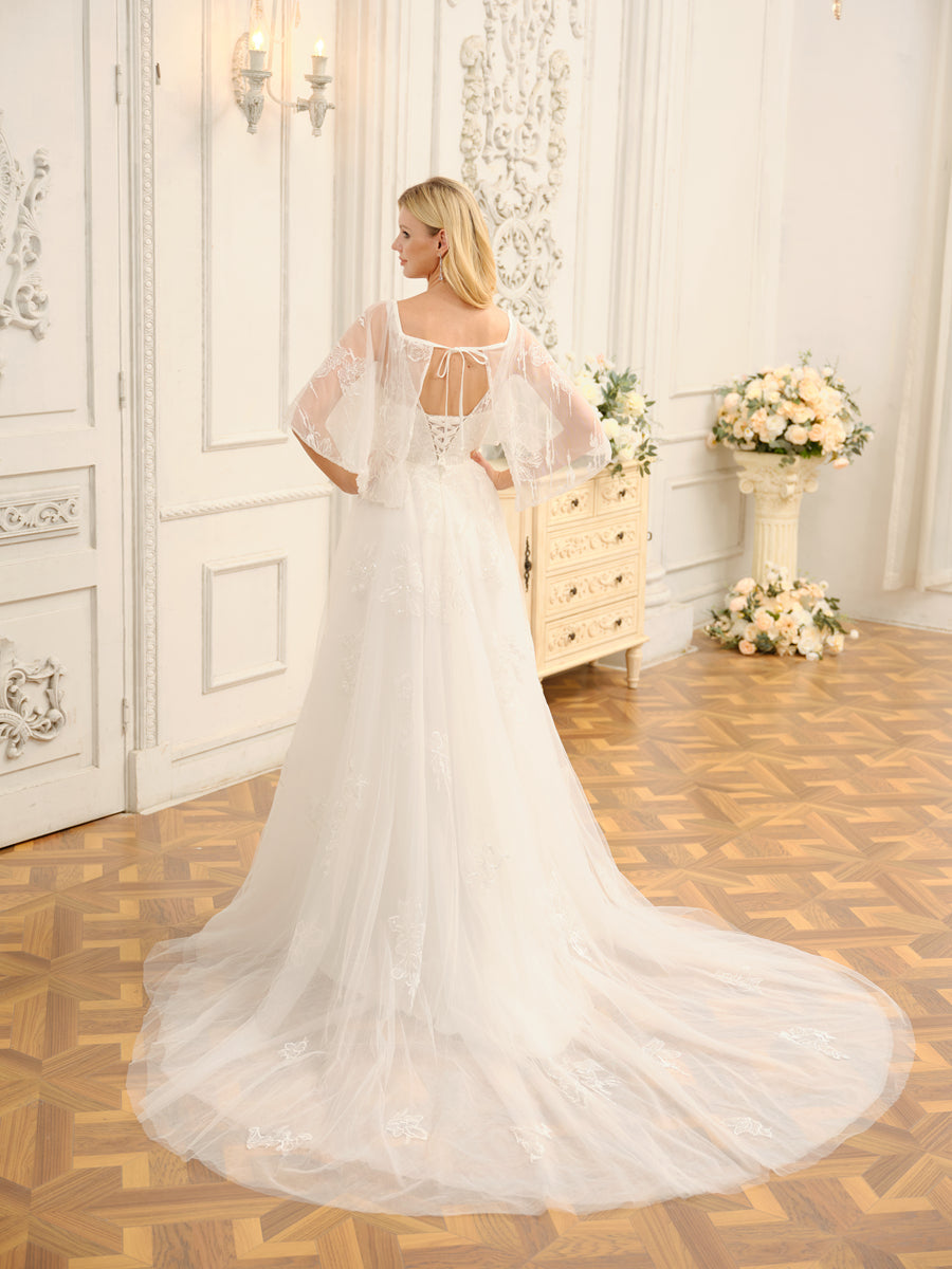 Side view of the Weitese A-Line wedding dress, showing half sleeves and flowing skirt.