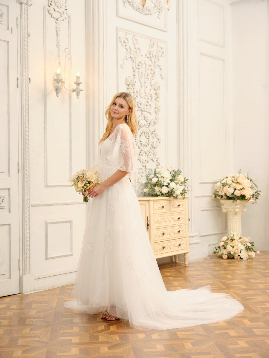 Bride wearing the elegant Weitese A-Line Princess wedding dress with half sleeves.