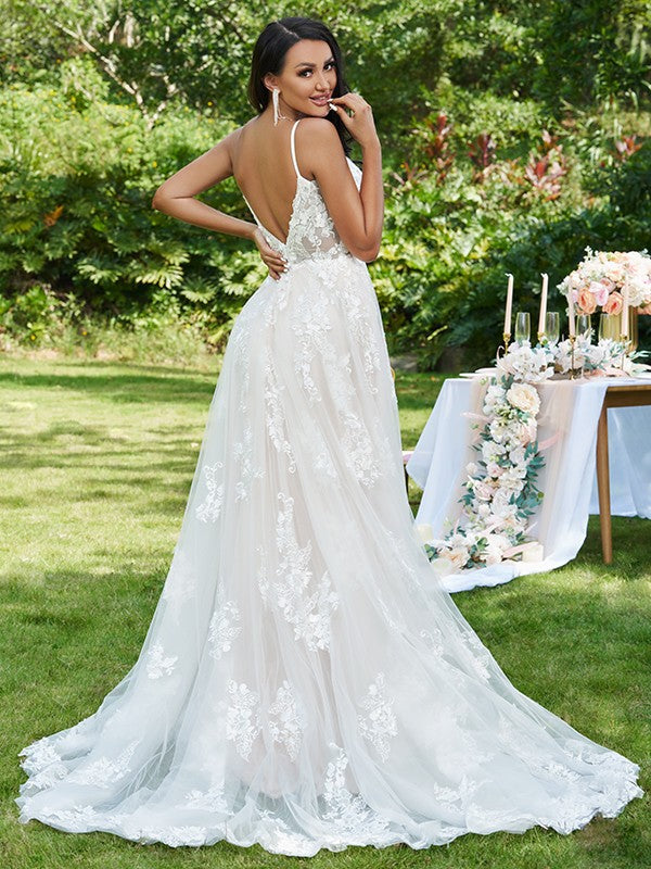 Close-up of the V-neckline and intricate lace applique on the Weitese bridal dress.