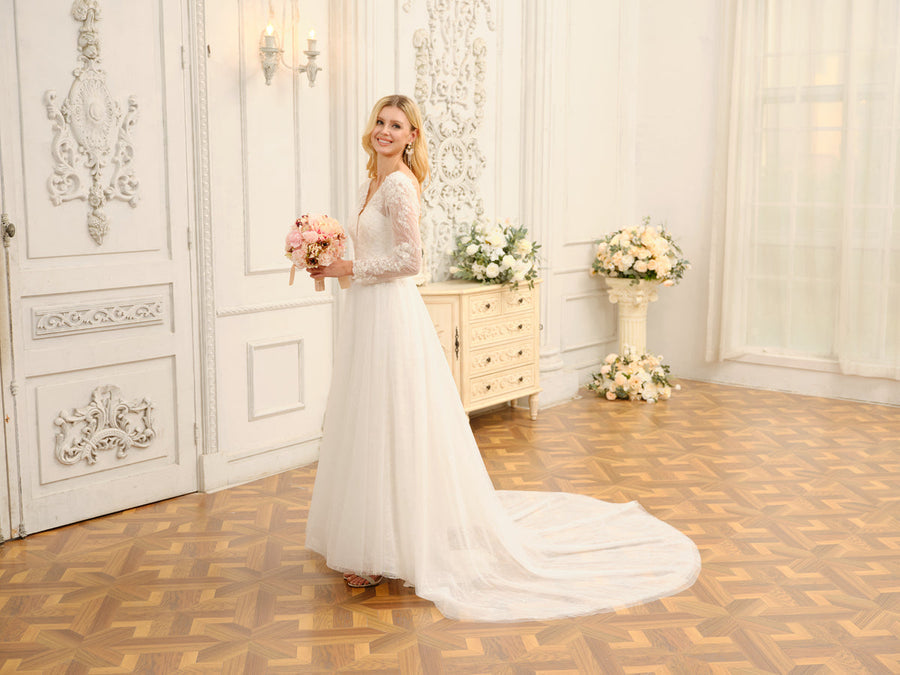 Close-up of the delicate lace and applique embellishments on the wedding dress.