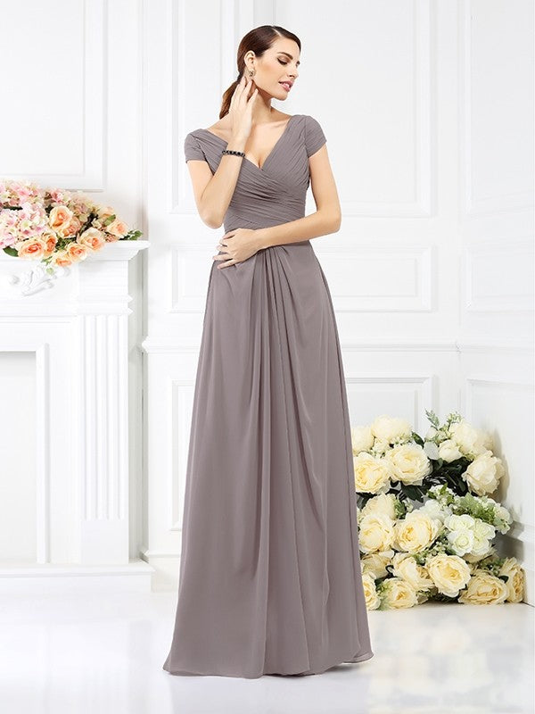 Close-up of the V-neckline and pleated bodice on the chiffon bridesmaid dress.