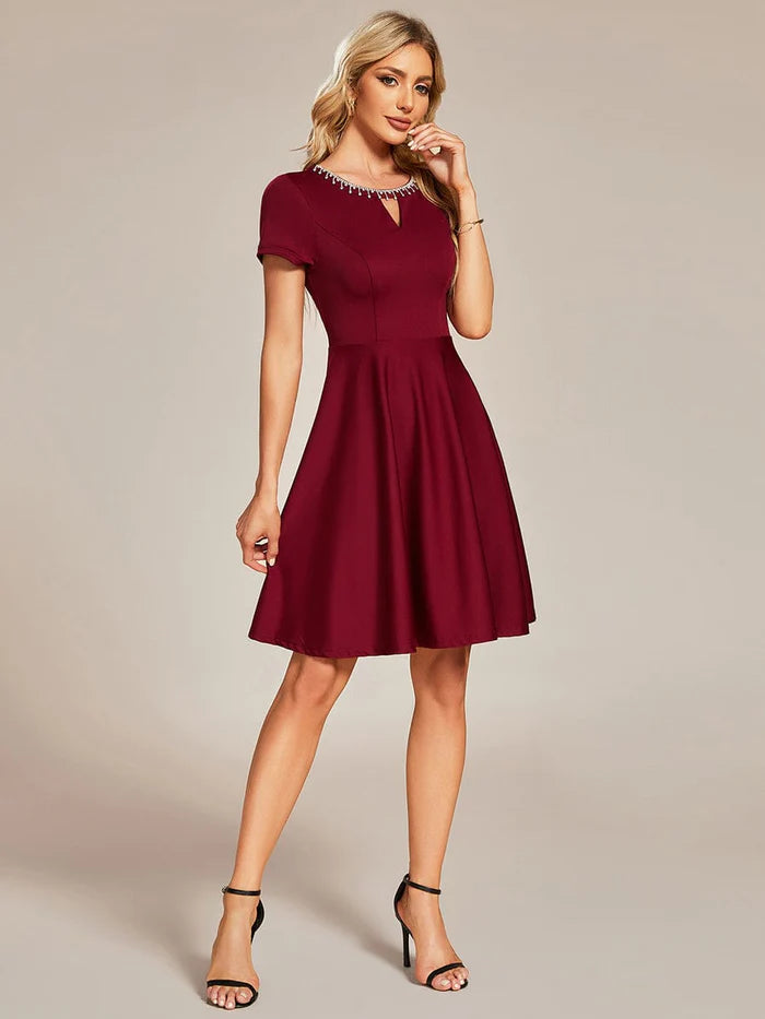 Model posing in a Weitese A-line mini dress, showcasing the A-line silhouette.