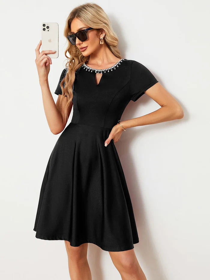 Back view of the Weitese A-line mini dress with short sleeves.