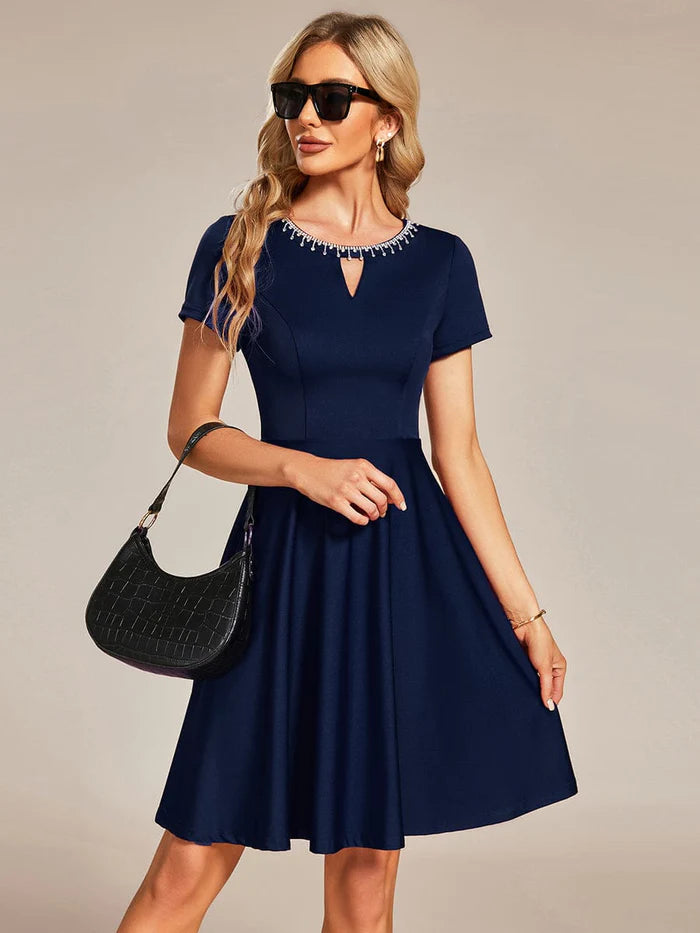 Side view of the Weitese A-line mini dress, showing the short sleeves.