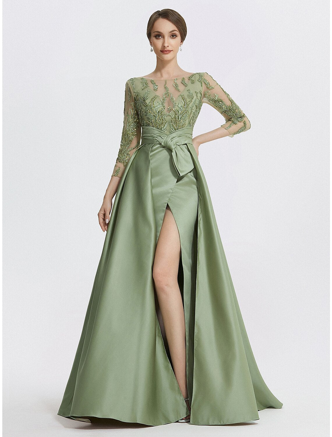 Elegant A-line satin evening gown with 3/4 sleeves, jewel neck, slit, and appliques.