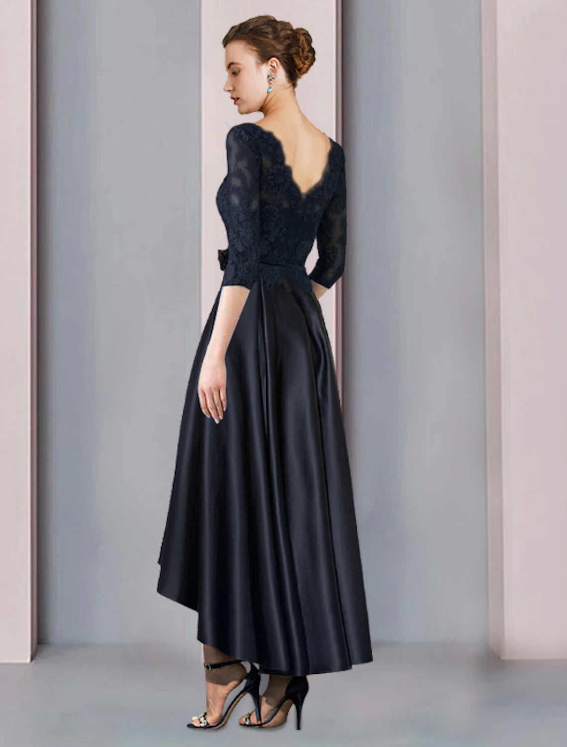 Side view of an elegant Weitese A-Line high-low tea length satin lace dress with pleats and appliques.