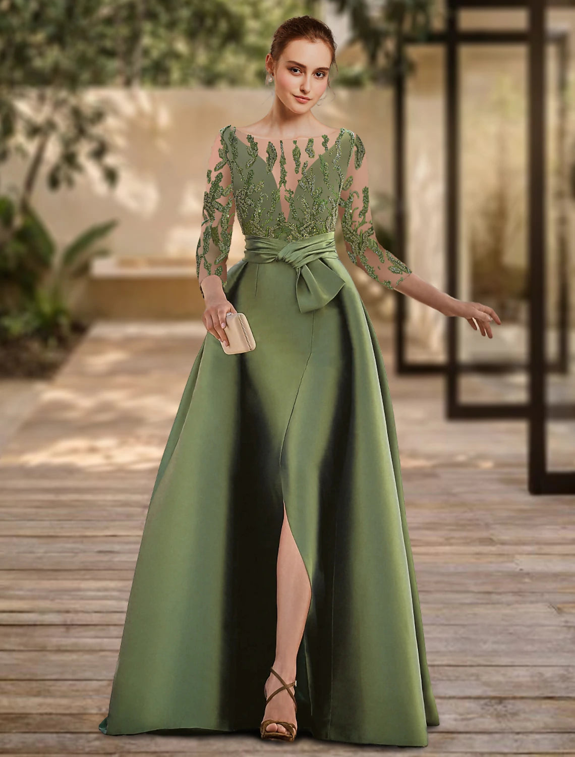 Model wearing an elegant A-line lace evening gown with 3/4 sleeves and a scoop neck.