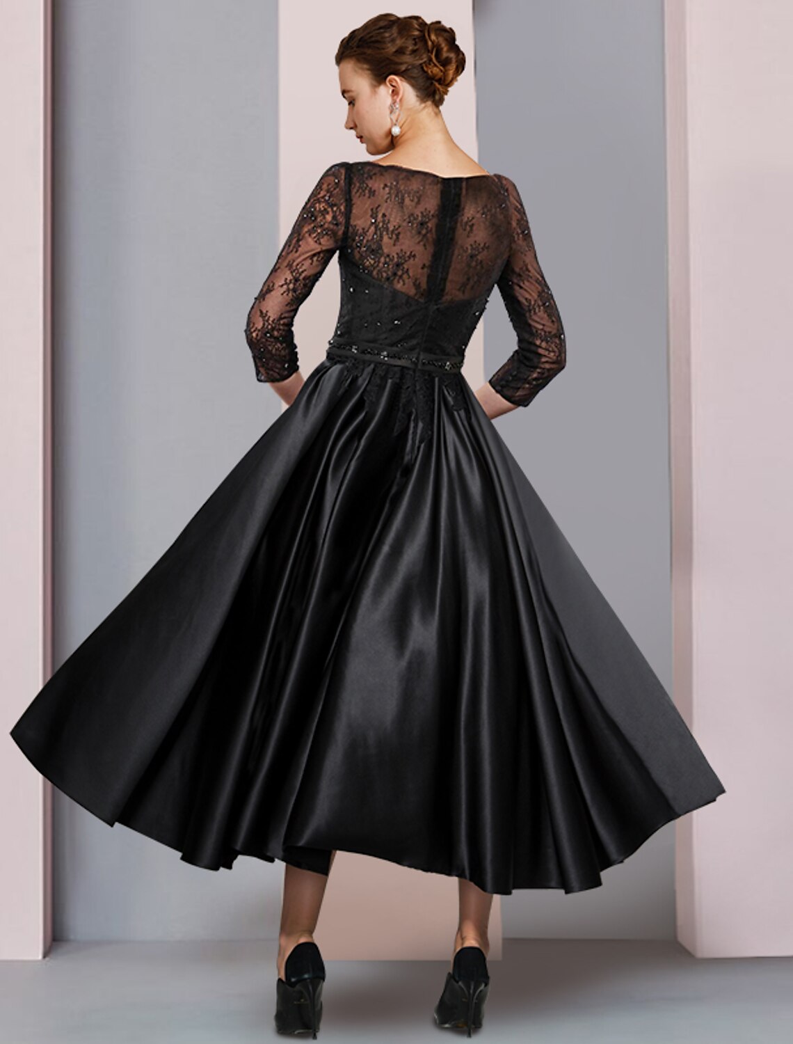 Elegant tea-length A-Line dress for wedding guests, featuring pleats and satin lace fabric.