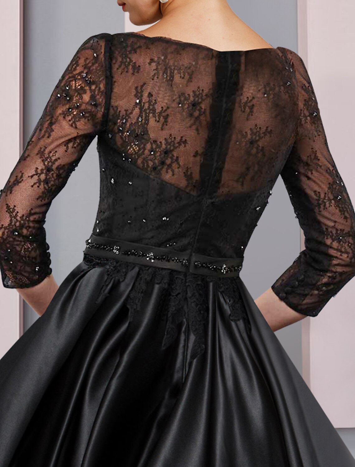 Formal A-Line gown with 3/4 sleeves and scoop neckline, suitable for special occasions.
