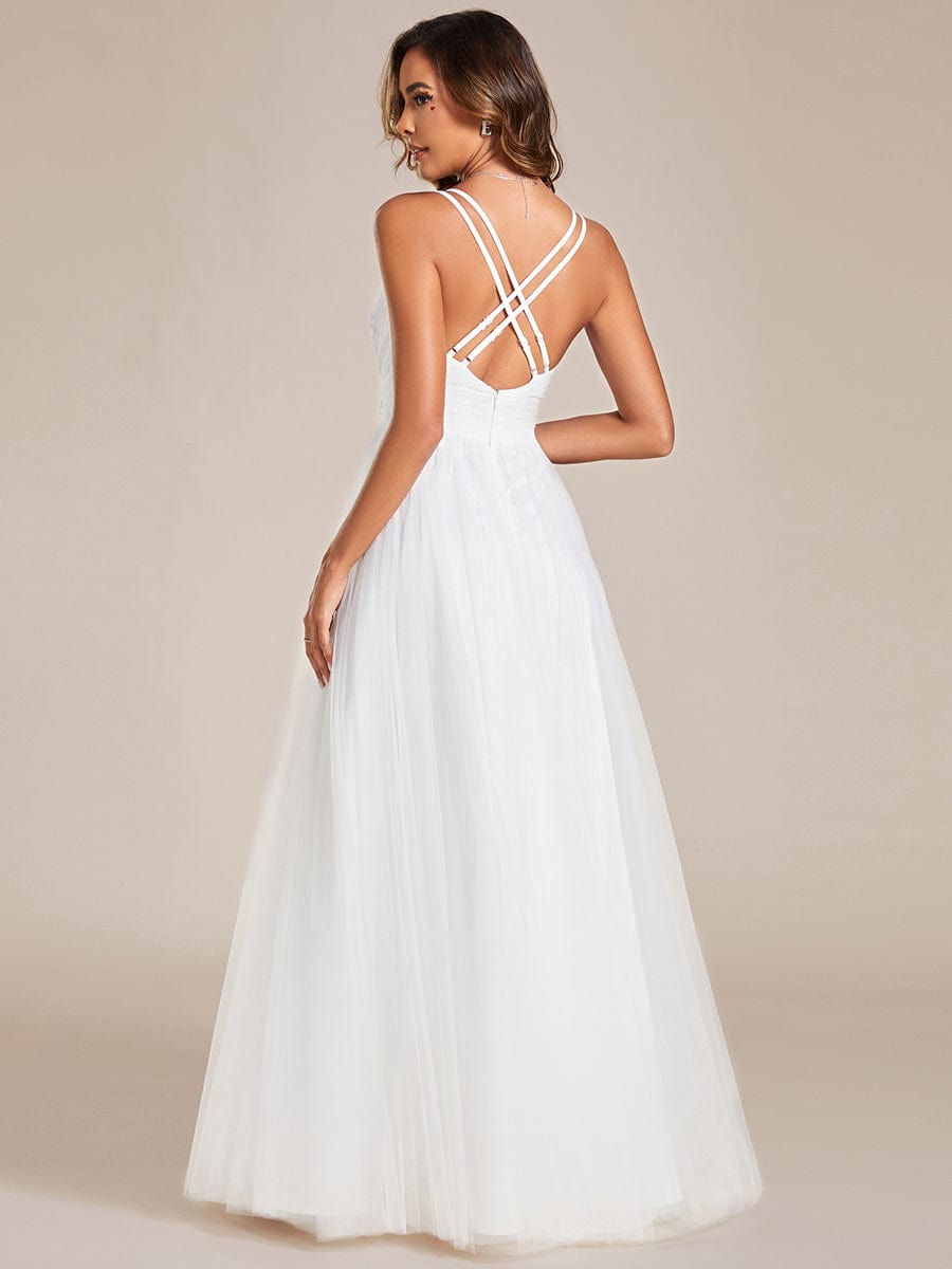 Back view of Weitese white bridesmaid dress, highlighting cross-back strap detail.