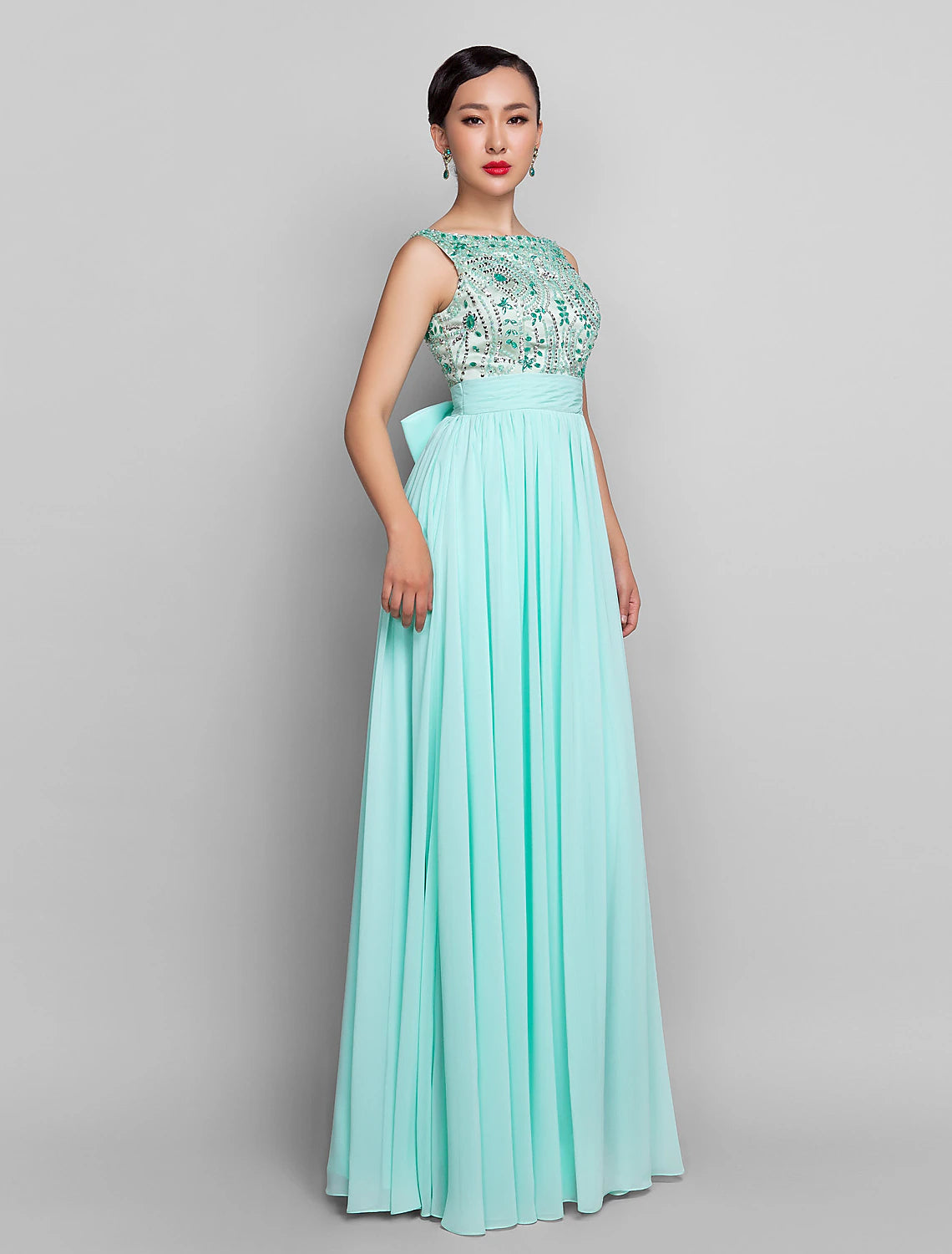 Back view of the Weitese A-line chiffon dress, showcasing the floor-length design and bow details.