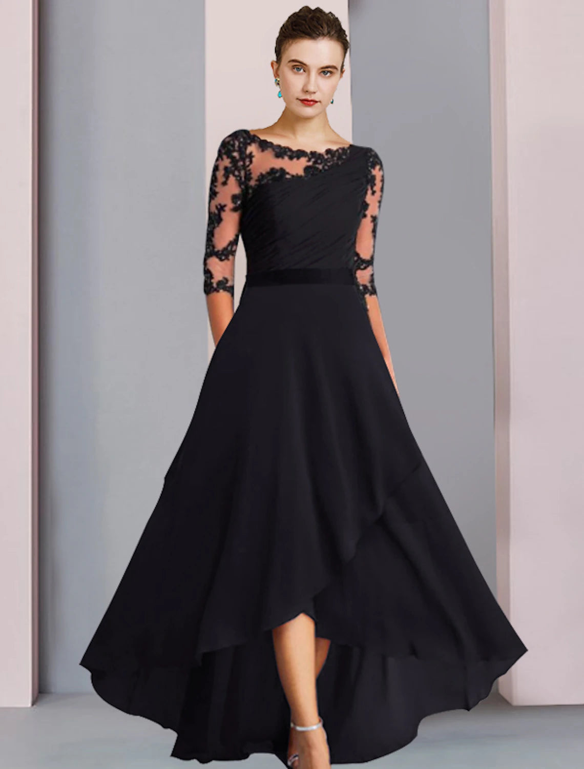Woman in elegant blue A-line high-low tea length dress with half sleeves and lace appliques.
