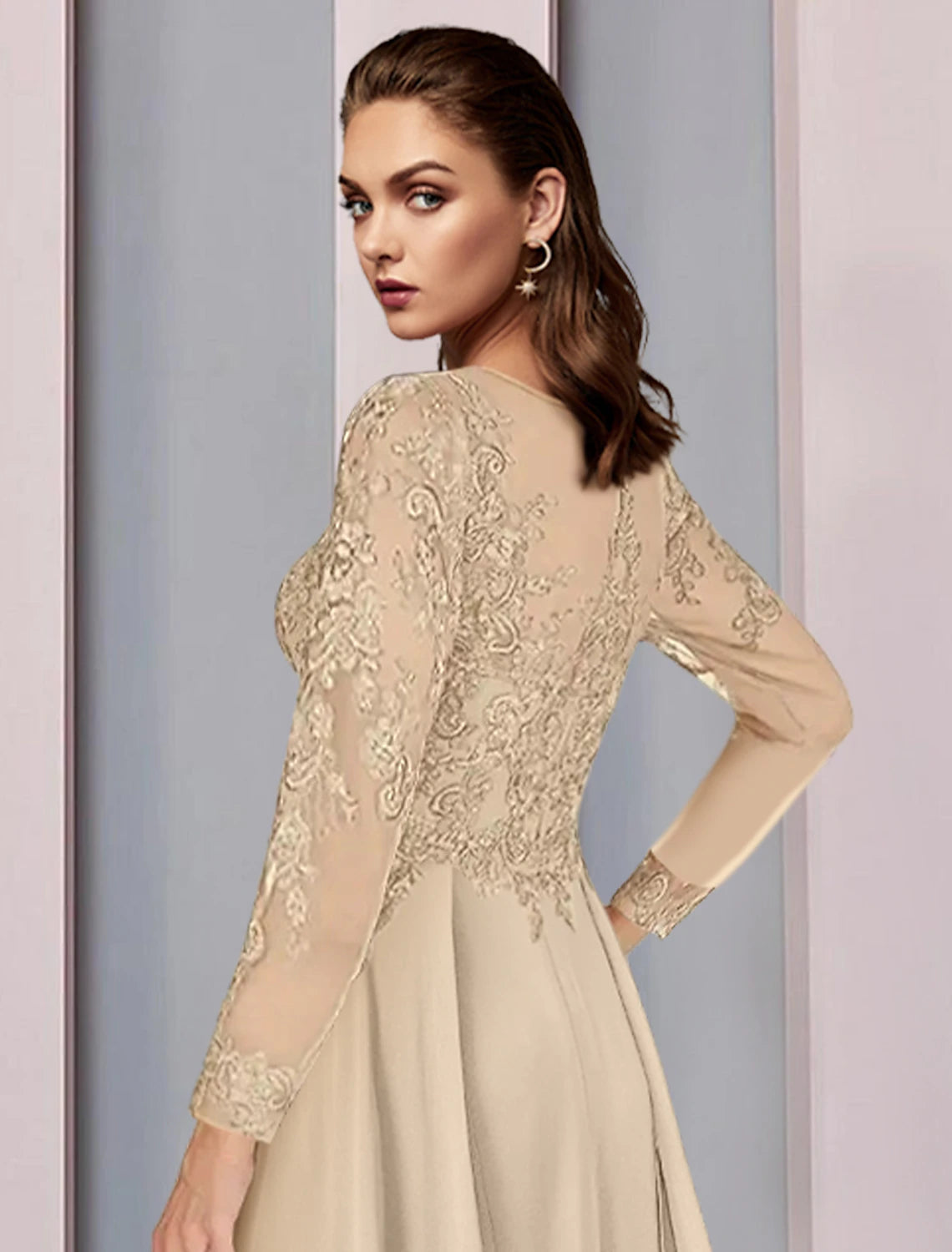 Close-up of the scoop neck and half sleeves on the elegant chiffon dress.