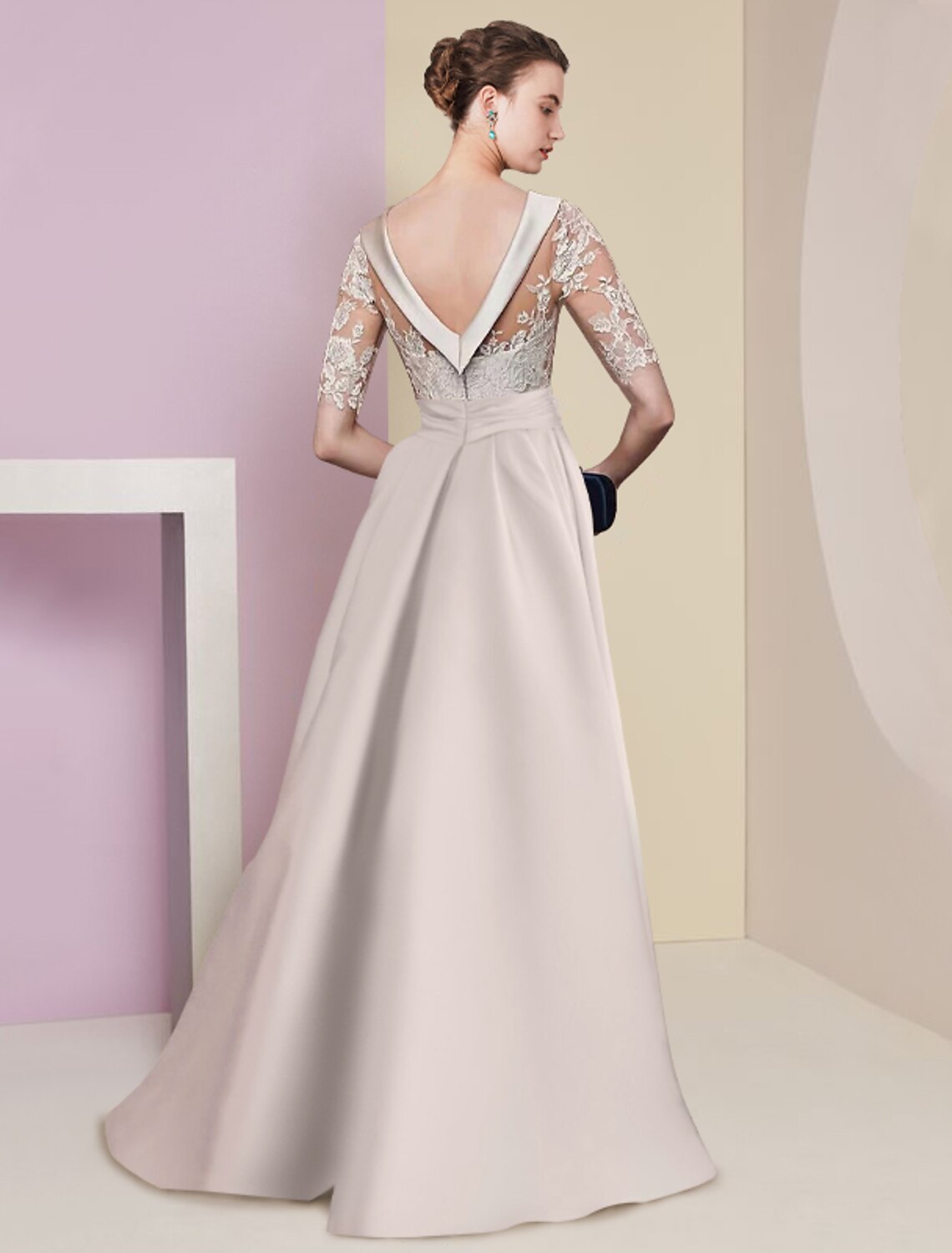 Back view of the A-line formal dress, highlighting lace details and appliques.