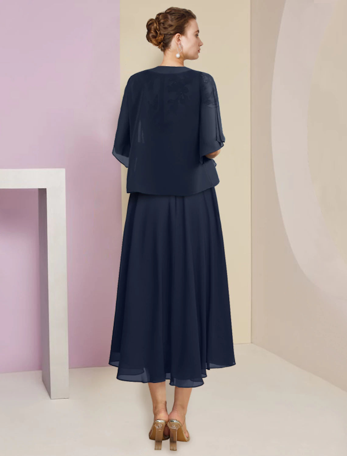 Close-up of the chiffon and lace details on the two-piece dress.