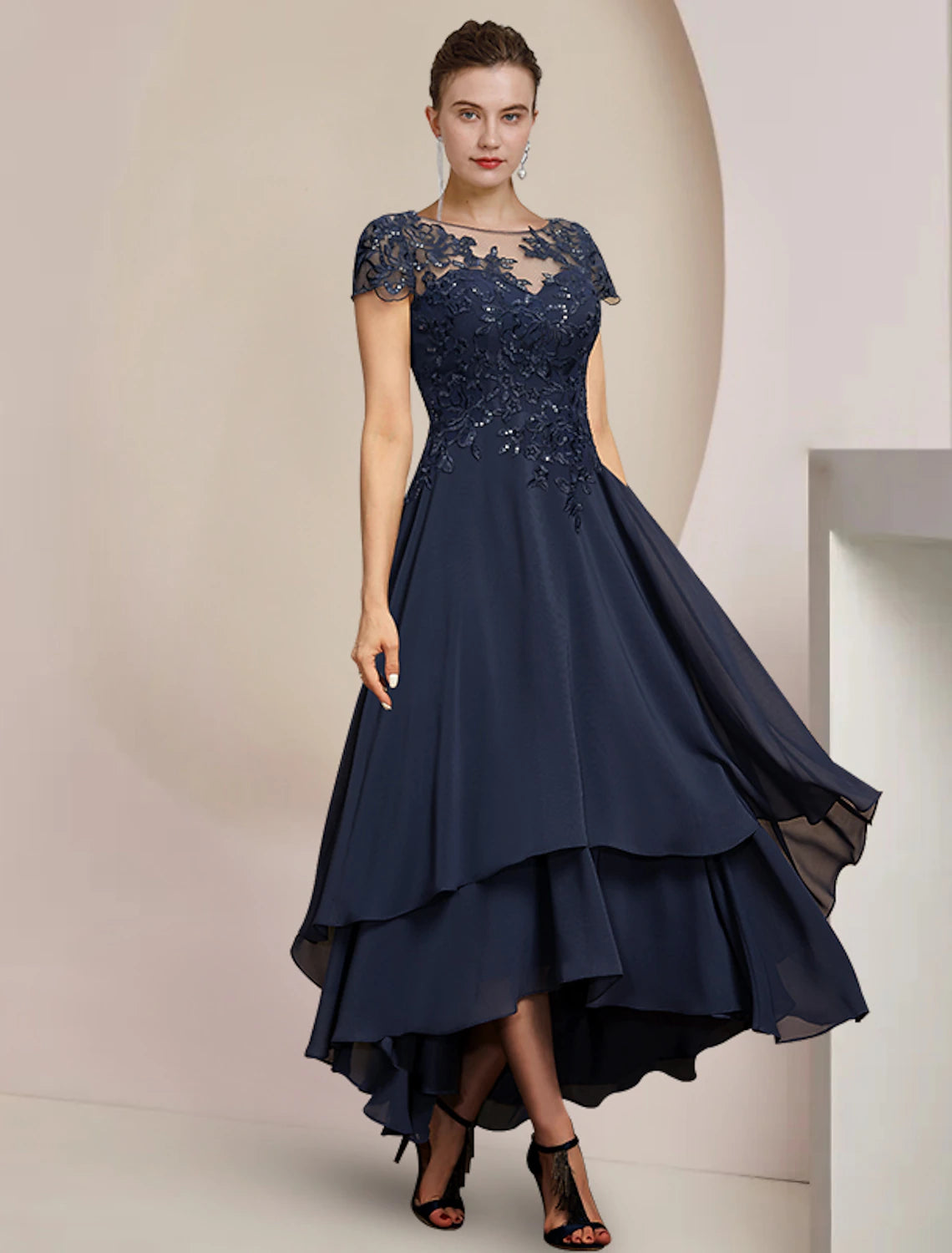 Elegant A-Line Mother of the Bride dress with scoop neck and short sleeves.