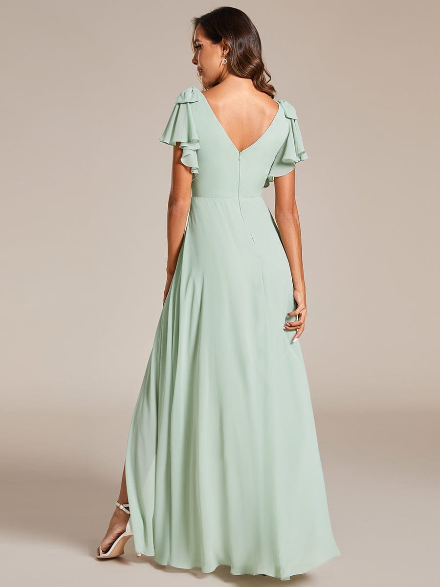 Close-up of bowknot and short sleeve on a green chiffon bridesmaid dress.