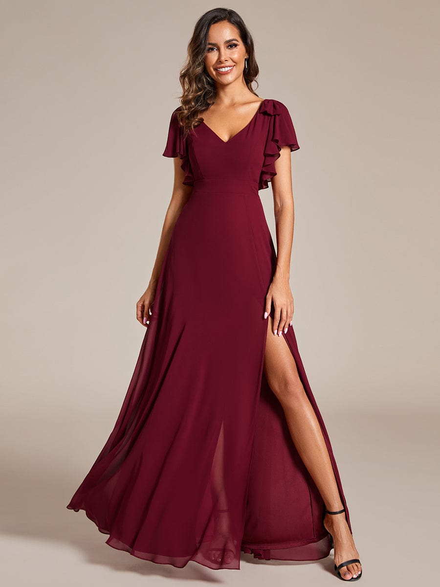 Full length view of a blue A-line chiffon bridesmaid dress.