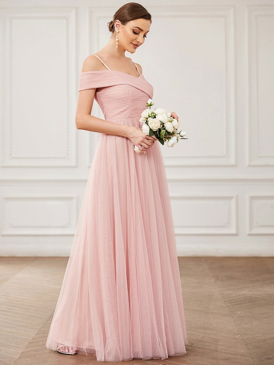 Full length view of the Weitese pink bridesmaid dress with spaghetti straps and cold shoulder.
