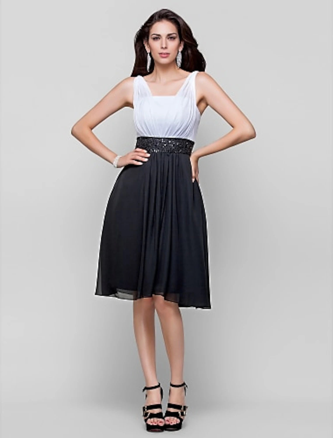 Elegant light blue chiffon knee-length cocktail dress with beading and draping.