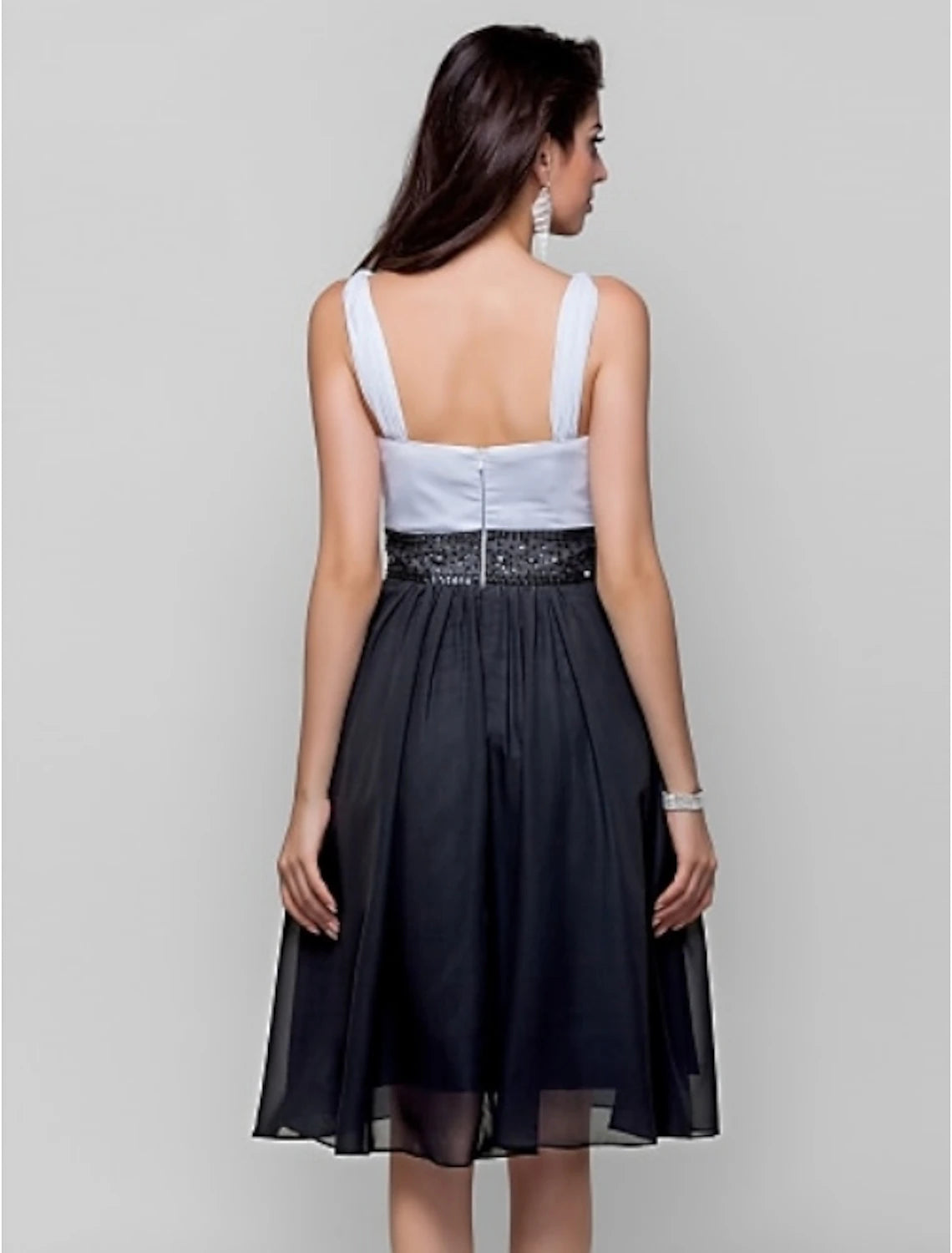 Close-up of the beaded bodice and strap detail on the chiffon dress.