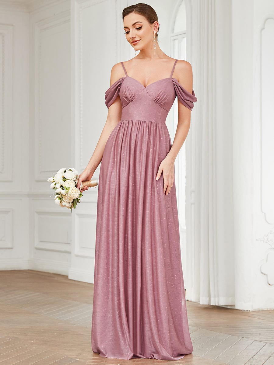 Close-up of the draped sleeve and cold shoulder detail on a bridesmaid dress.