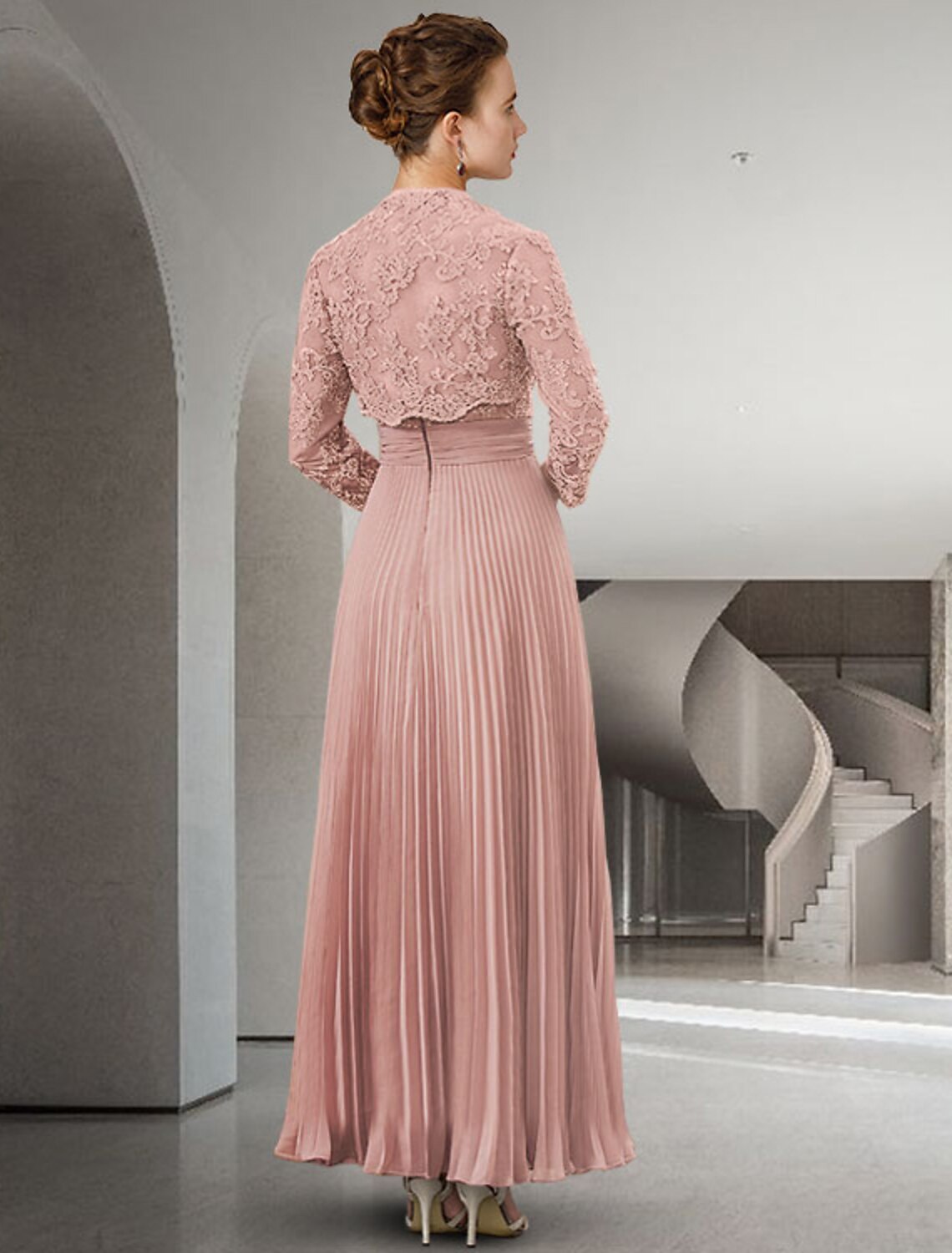 Full view of a woman in a graceful ankle-length chiffon lace mother of the bride dress with a matching wrap.