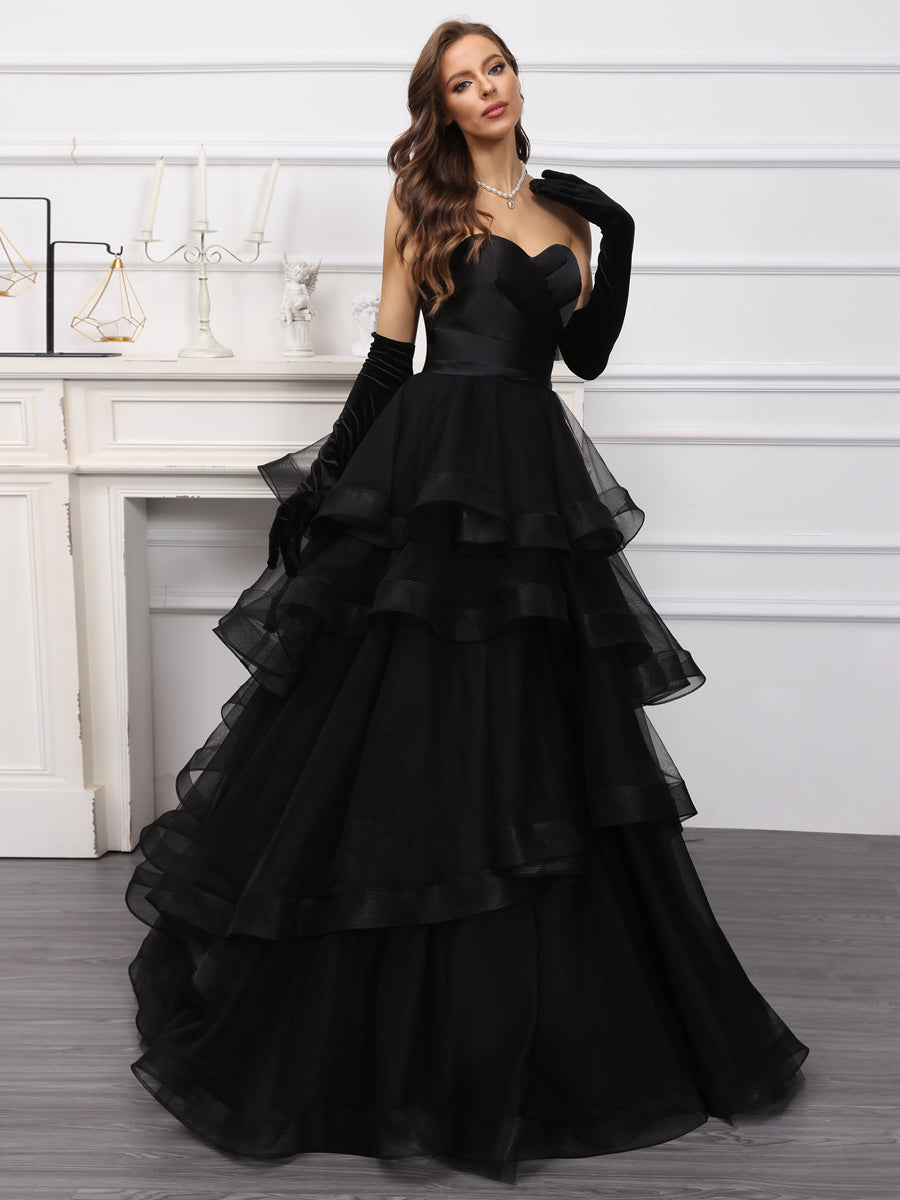 Back view of the long tulle wedding dress showing ruffles.