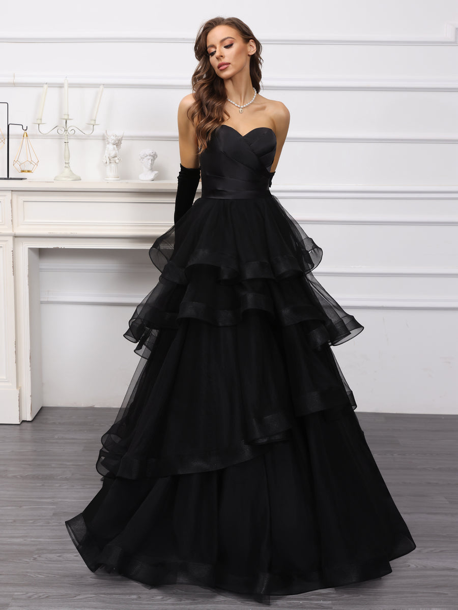 Close-up of the sweetheart neckline and ruffled details on the dress.