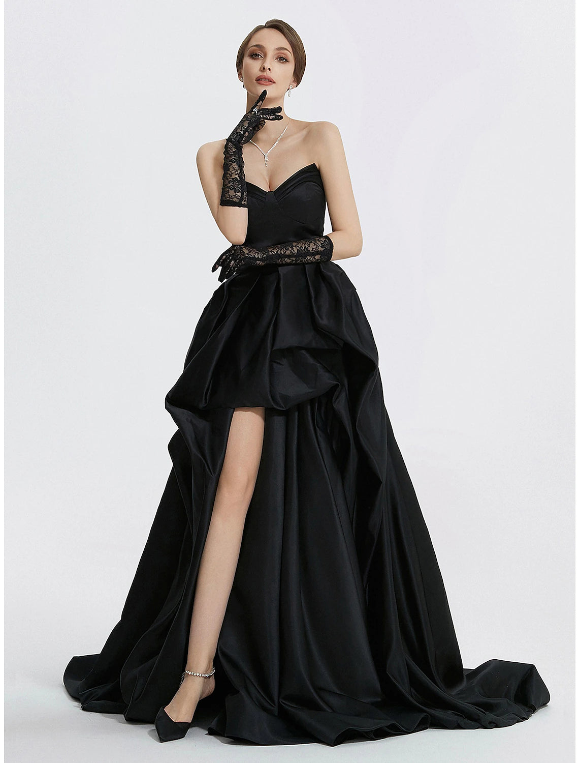 Woman wearing Weitese A-Line sweetheart satin evening gown with ruched slit.