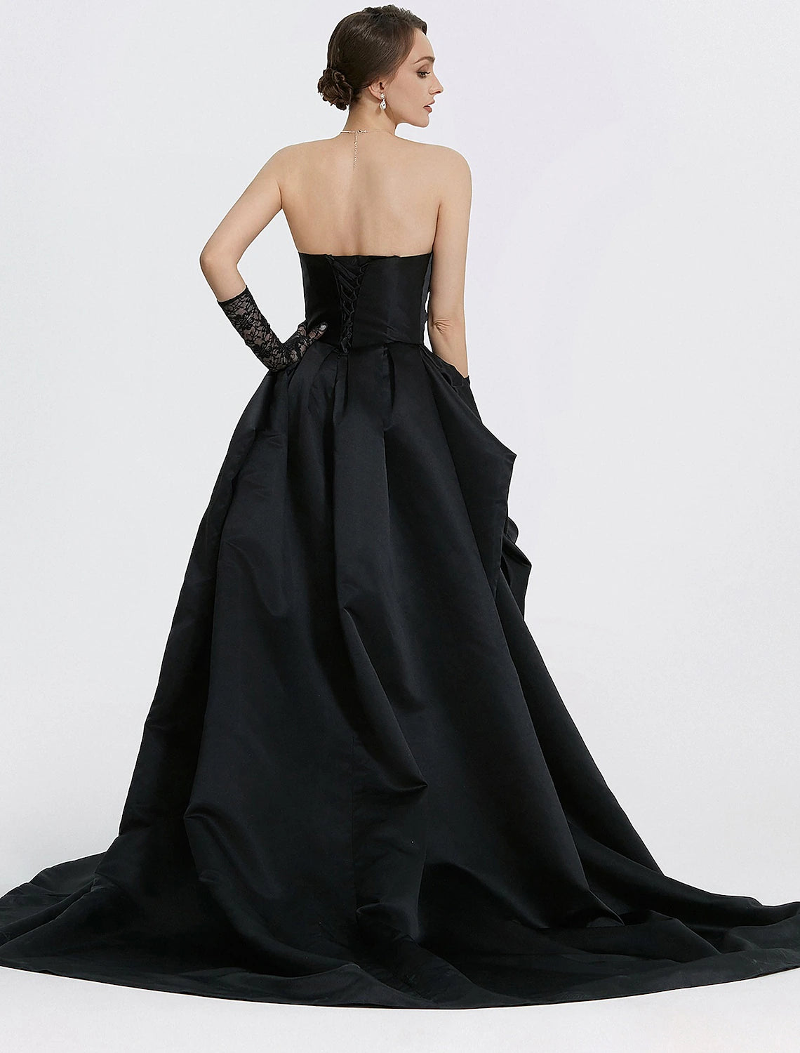 Side view of woman in Weitese A-Line satin gown, highlighting sweep train.