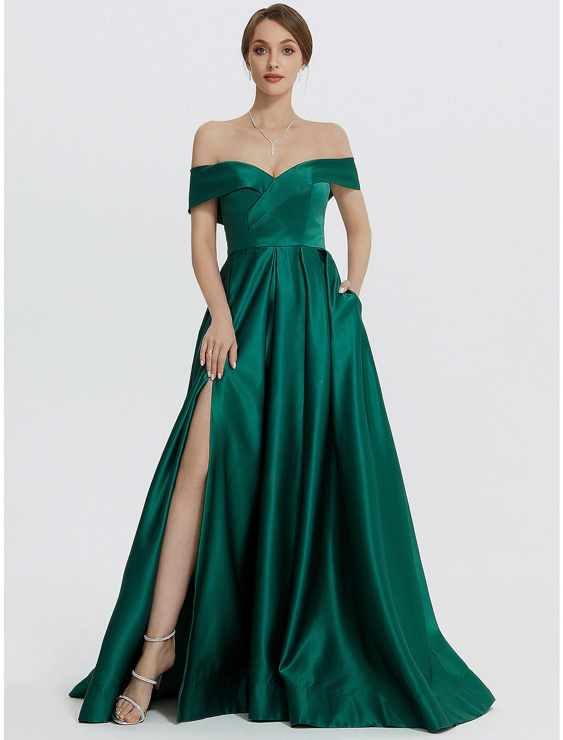 Model wearing a red A-line satin gown with a sweetheart neckline and high slit.