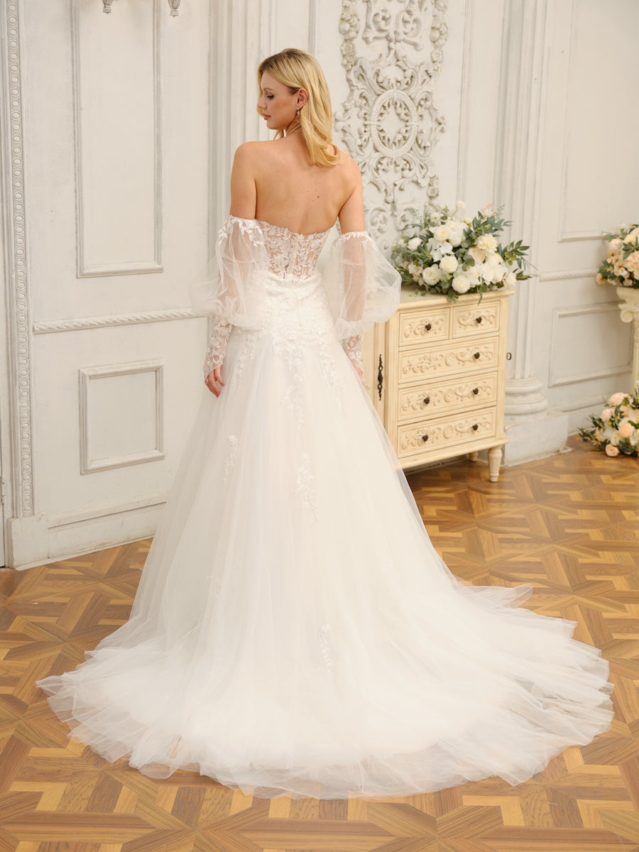 Close-up of the sweetheart neckline and delicate appliques on the wedding dress bodice.