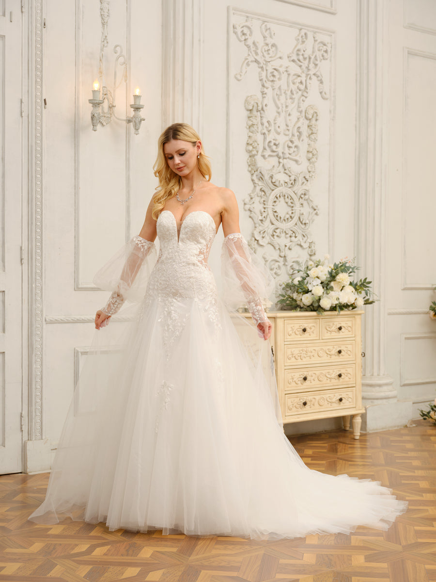 Side profile of the bride in the A-line wedding dress, highlighting the silhouette.