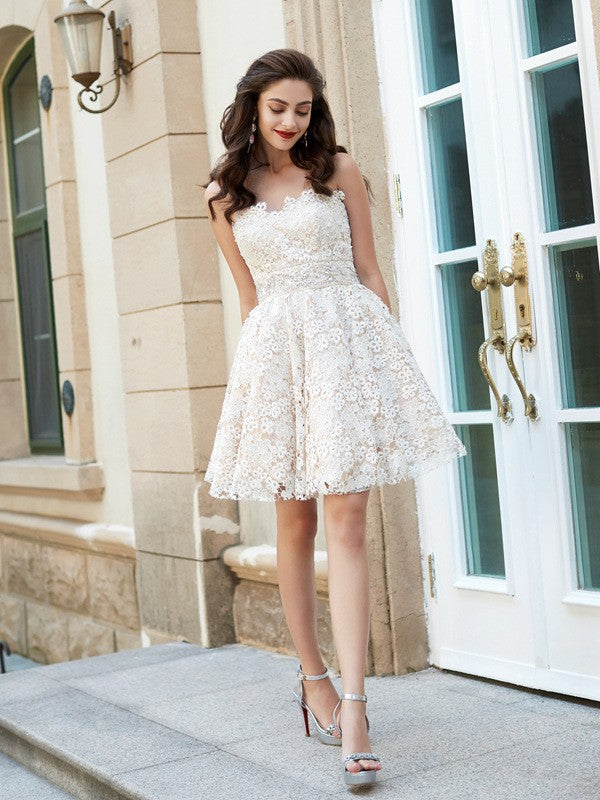 Front view of a woman wearing a Weitese A-Line sweetheart mini party dress with rhinestone and lace details.