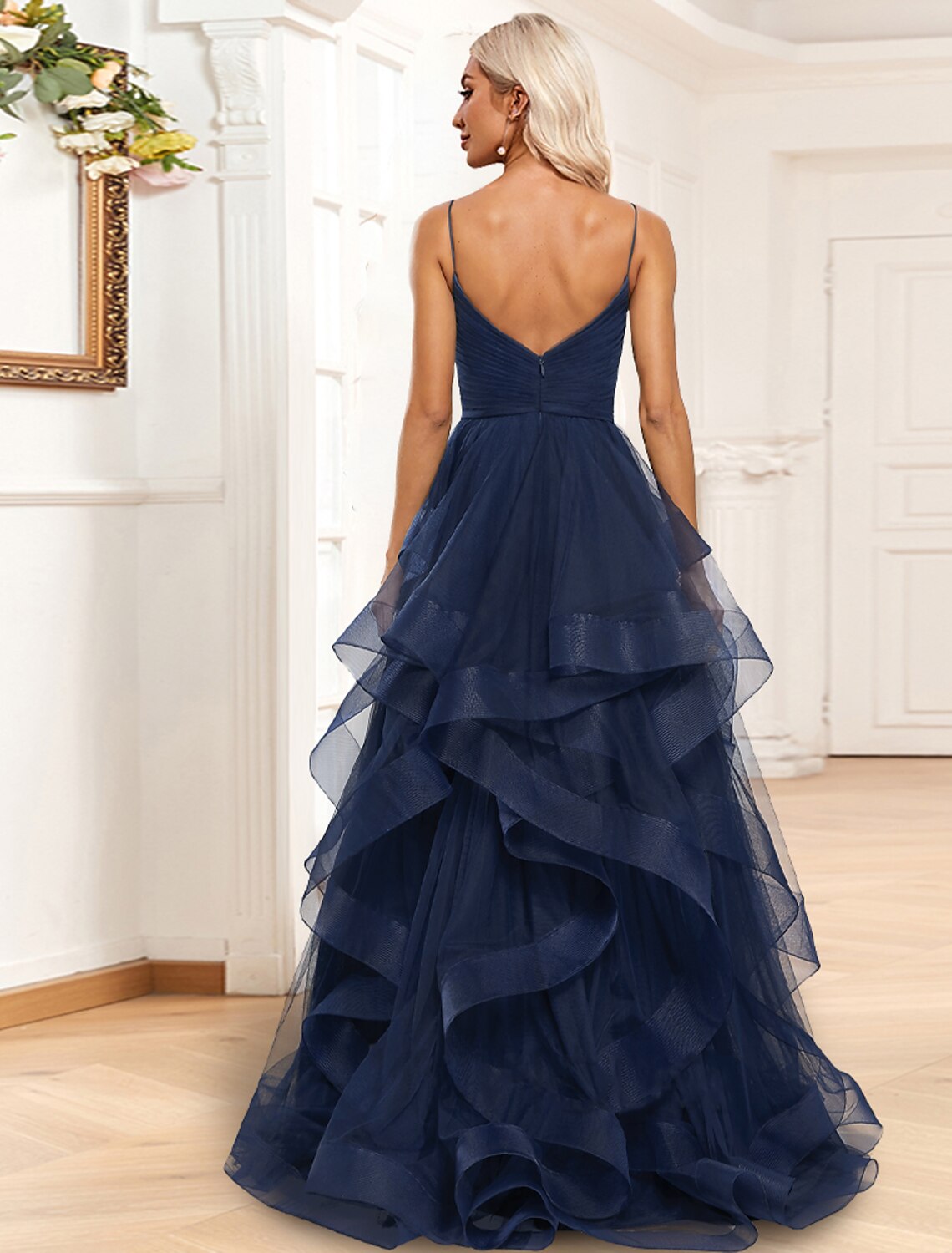 Close-up of the tiered plisse detail and ruched ruffles on the Weitese A-line evening gown.